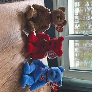 Retired beanies Curly, Osito, and America.  Perfect condition!